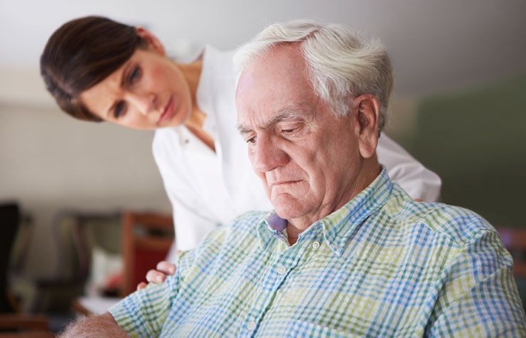 A woman looking unhappy at her senior father.