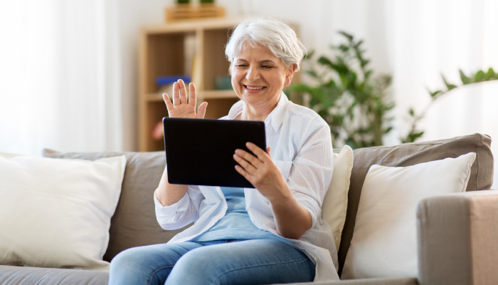 Long Distance Caregiving Senior on Tablet 