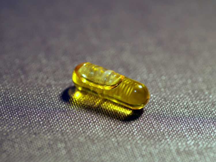 A vitamin D capsule.