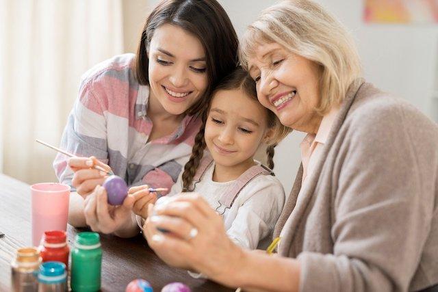 A mother and grandmother with a child at Easter.